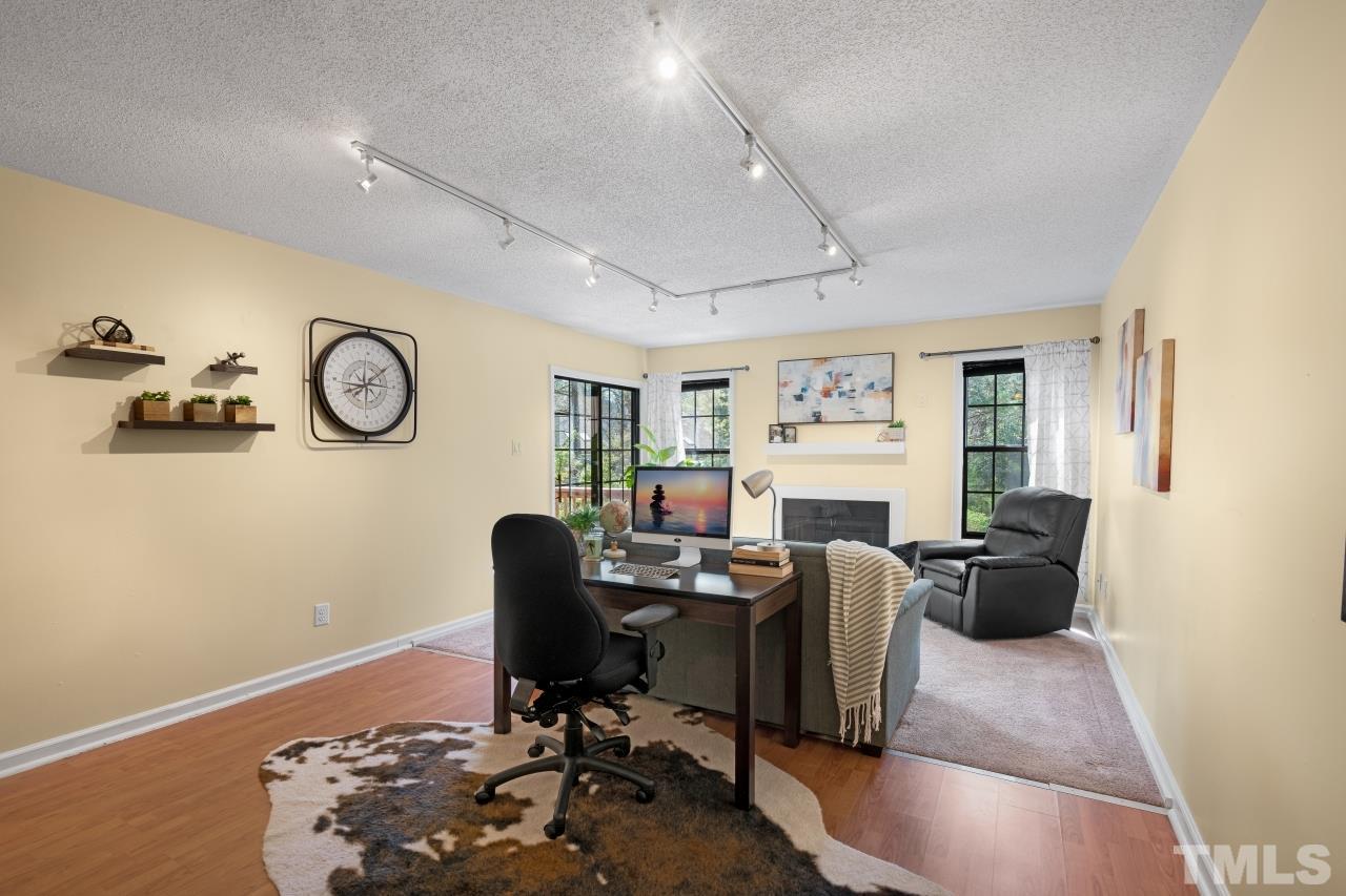 3706 Chimney Ridge Place, Unit 4 Durham, NC 27713 - Photo 9 of 29 a work room with furniture and wooden floor
