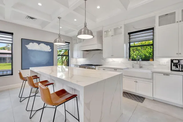 a view of a room that has a table and chairs