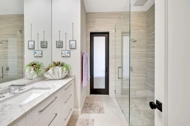 a spacious bedroom with a large bed and a window