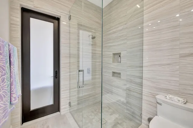 a bedroom with furniture and a flat screen tv