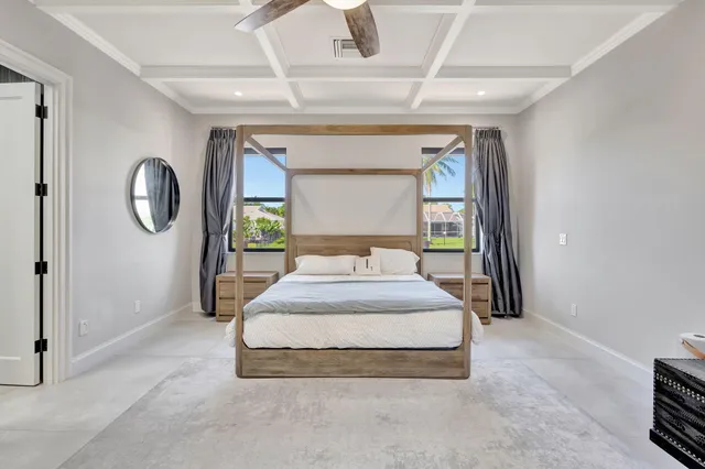 a spacious bedroom with a bed and a shower