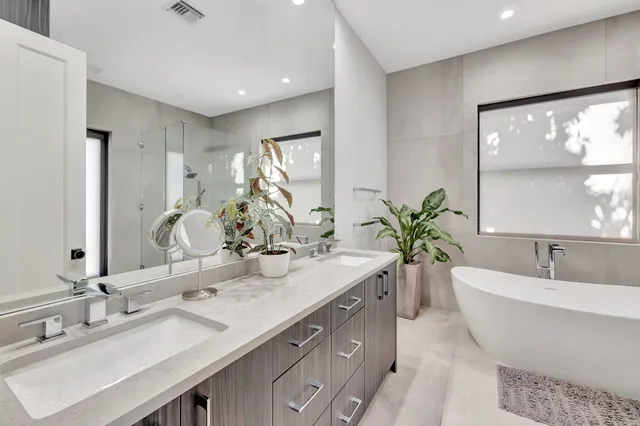 a view of a car garage with a car parked in front of it