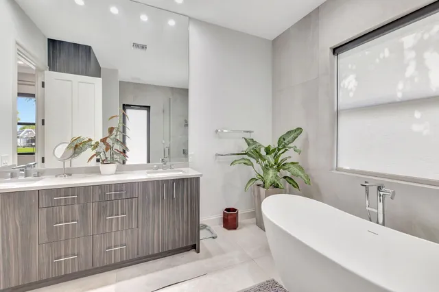 a view of a house with pool and sitting area