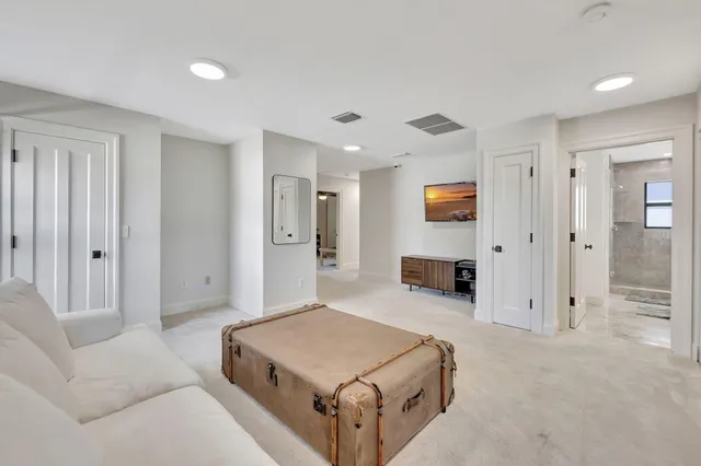 a view of a house with swimming pool and sitting area