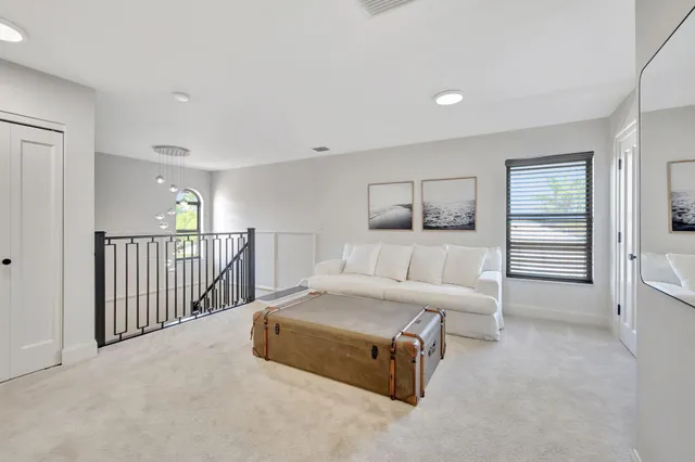a view of a lake with a table and chairs