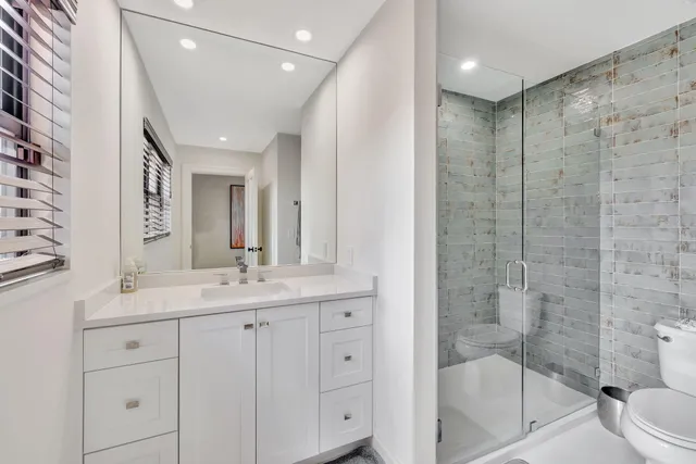 an aerial view of a houses with a lake view