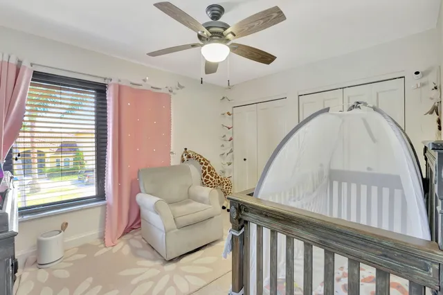an aerial view of residential houses with outdoor space and a street view