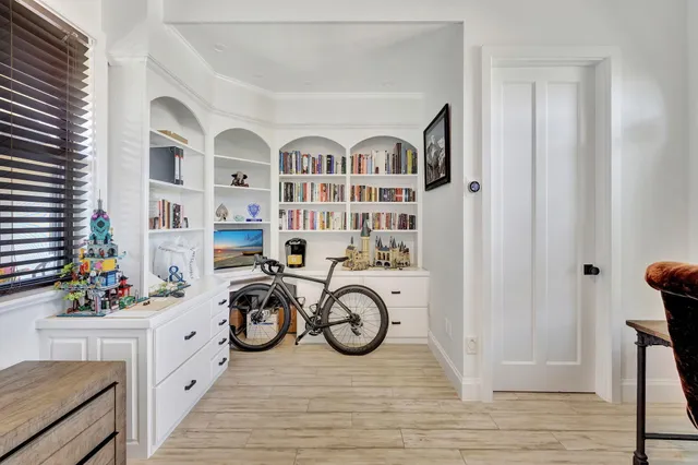 a front view of a house with a yard and a garage