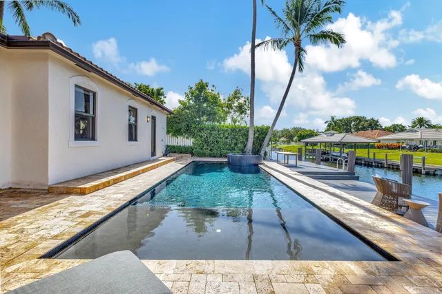 a view of swimming pool with a patio