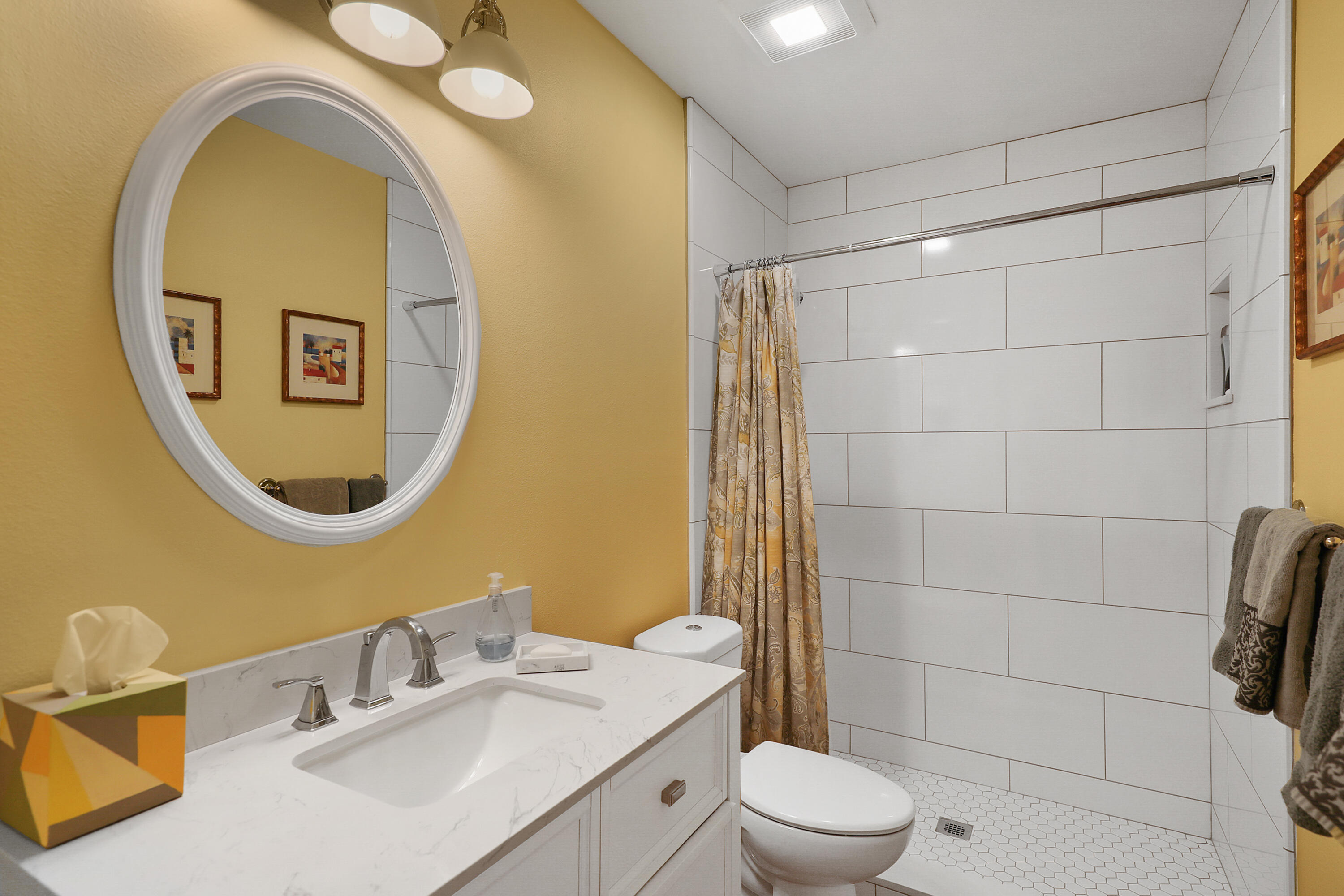 23 La Ronda Drive Rancho Mirage, CA 92270 - Photo 15 of 34 a bathroom with a toilet sink vanity and mirror