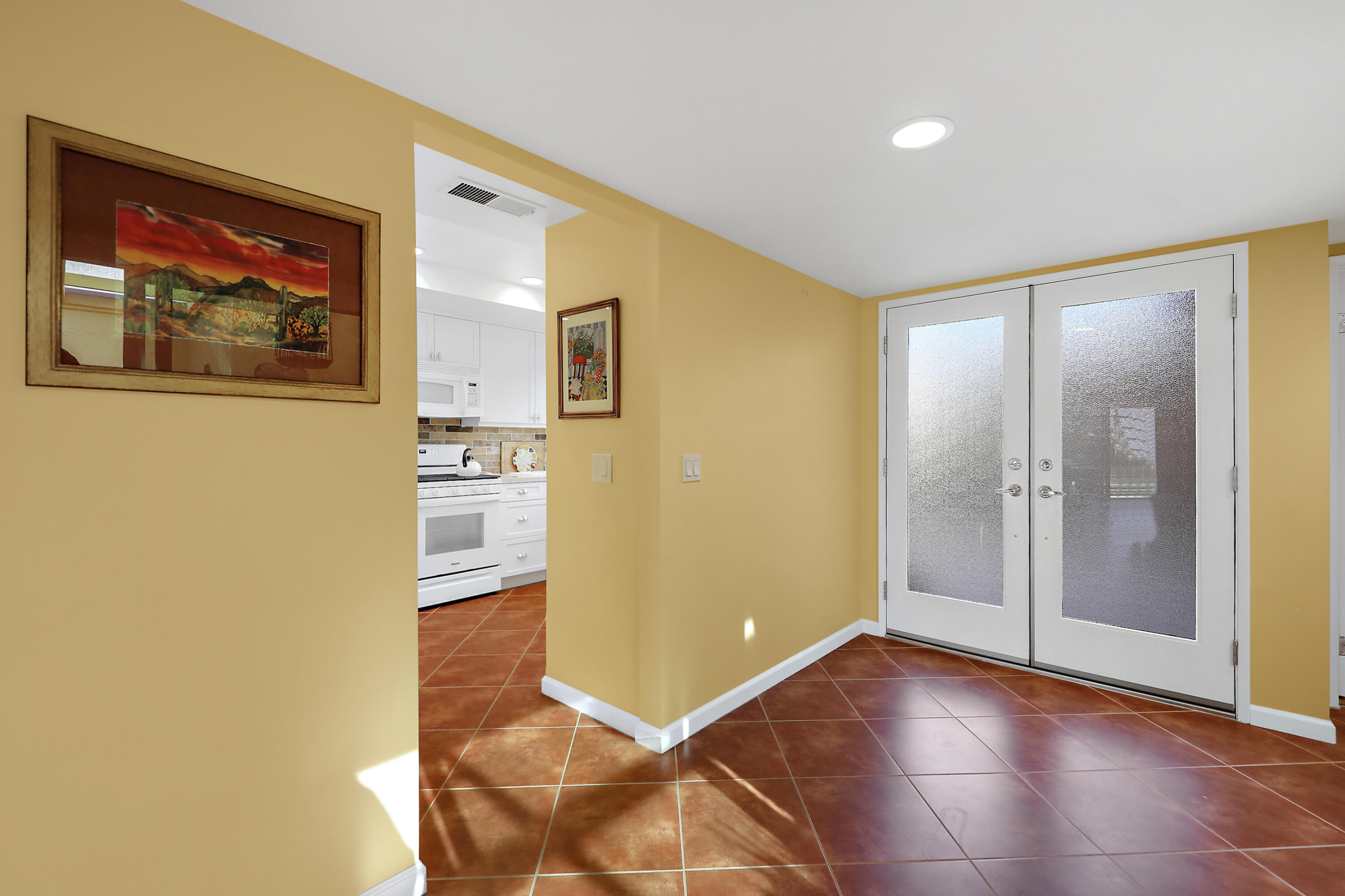 23 La Ronda Drive Rancho Mirage, CA 92270 - Photo 22 of 34 a view of a hallway with wooden floor