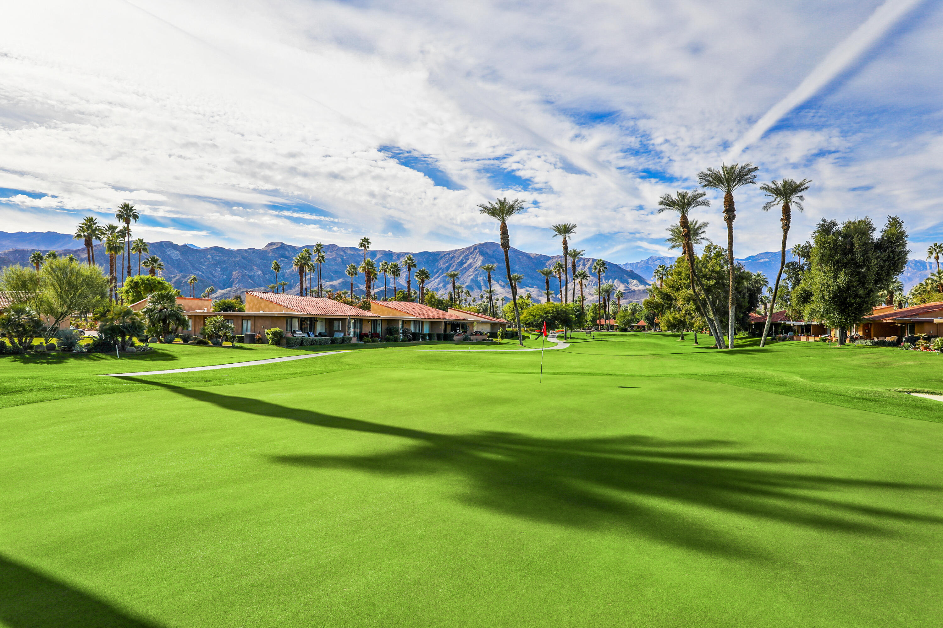23 La Ronda Drive Rancho Mirage, CA 92270 - Photo 31 of 34 a view of a field of grass and trees