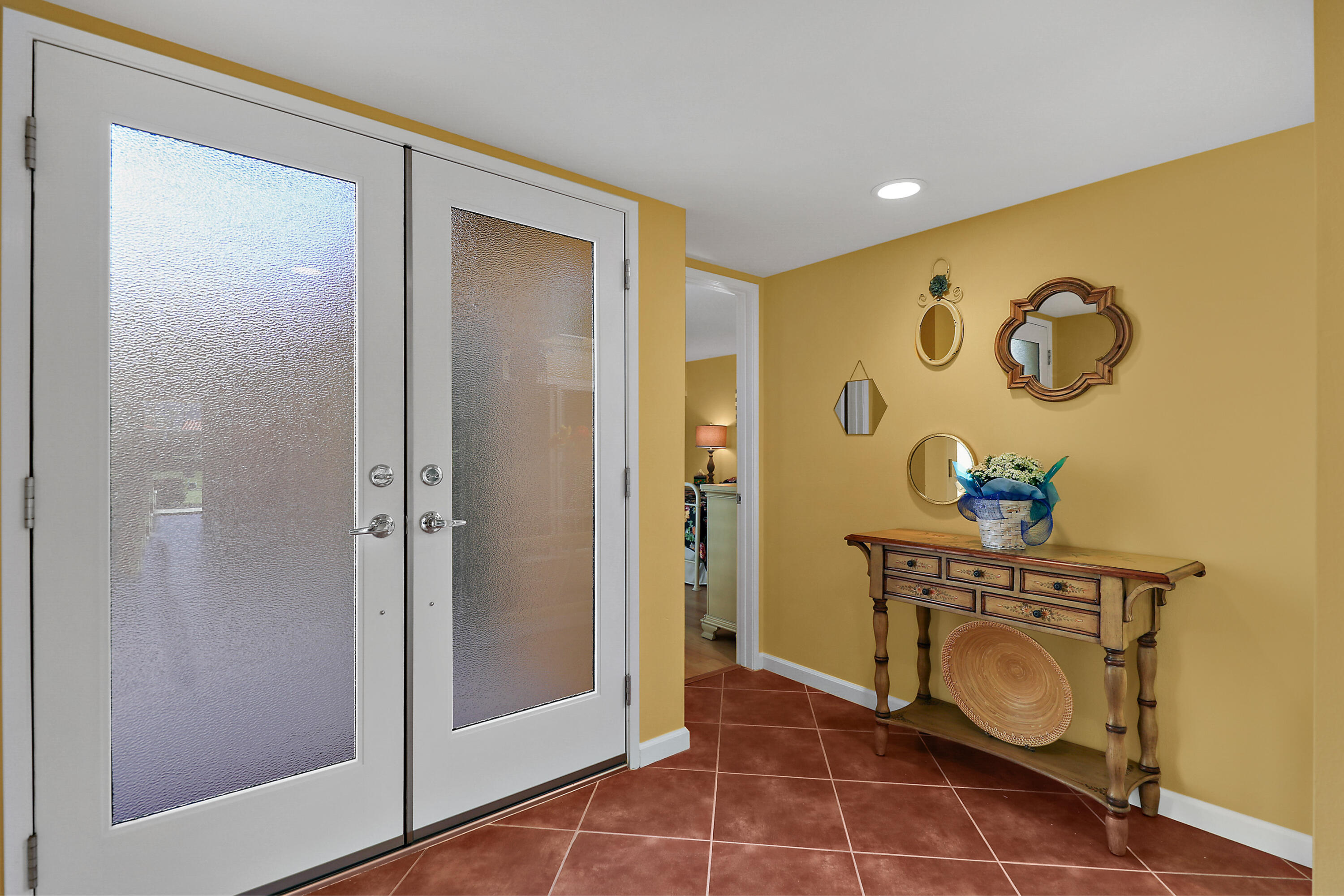 23 La Ronda Drive Rancho Mirage, CA 92270 - Photo 4 of 34 a view of a entryway door with wooden floor