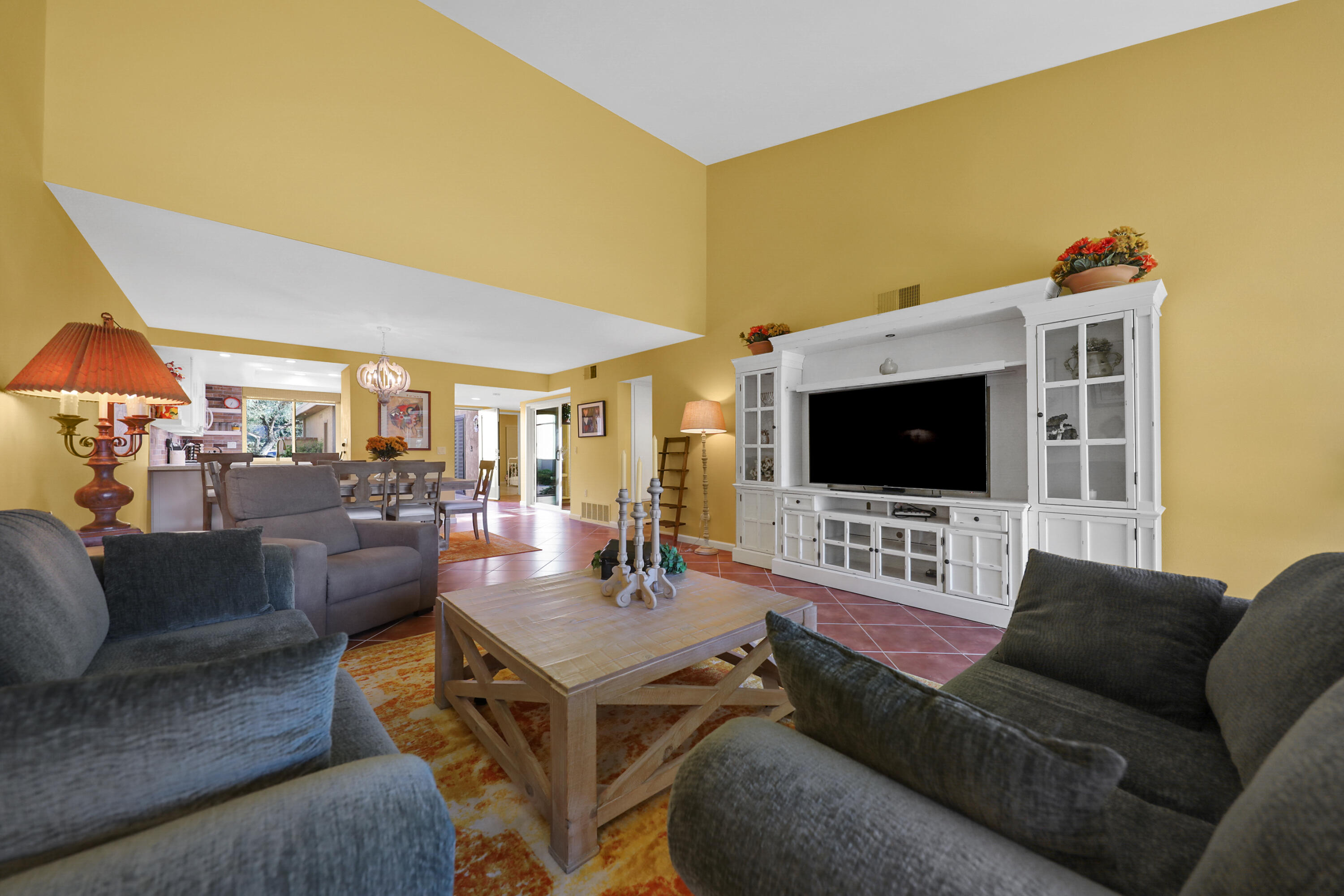 23 La Ronda Drive Rancho Mirage, CA 92270 - Photo 7 of 34 a living room with furniture and a flat screen tv
