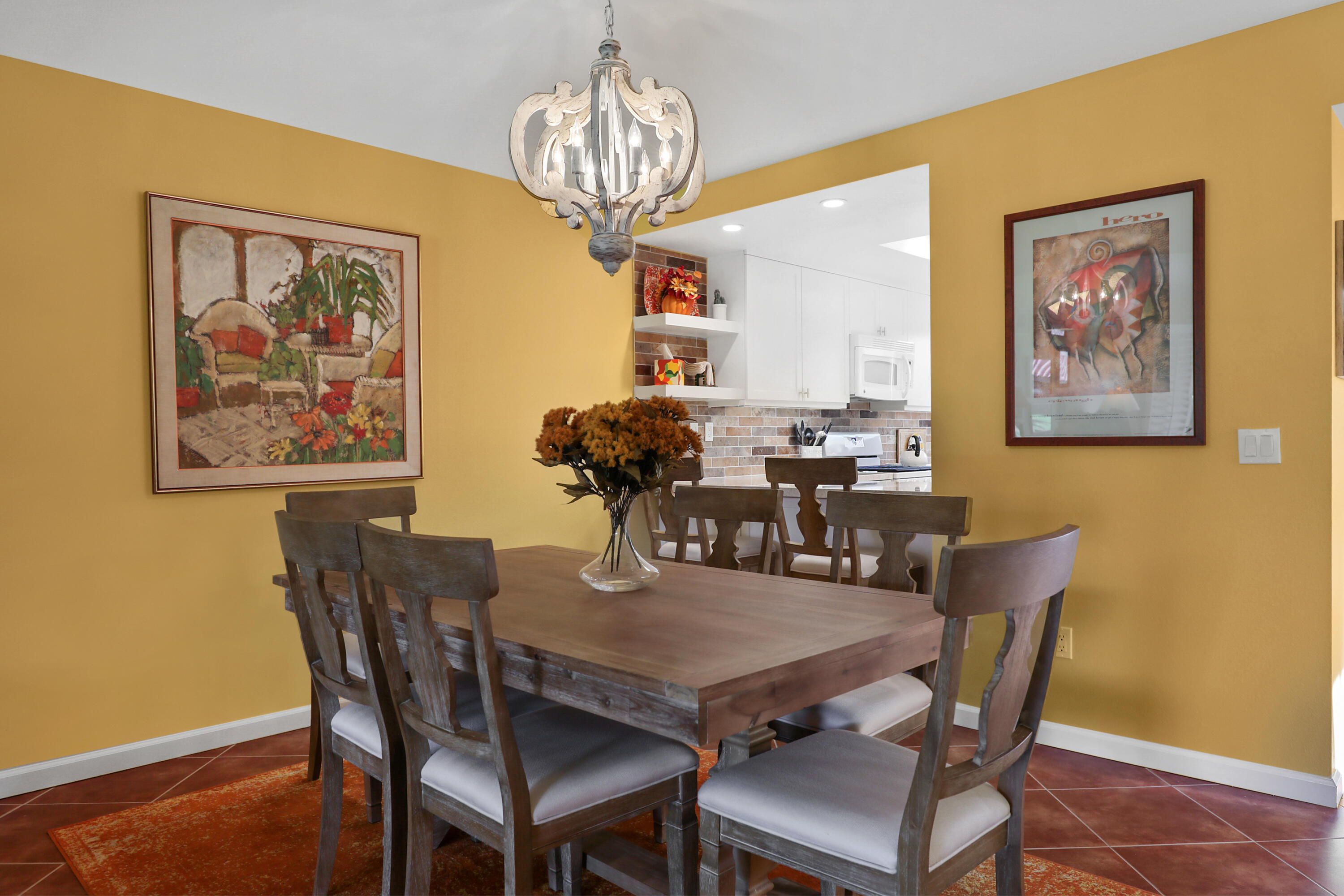 23 La Ronda Drive Rancho Mirage, CA 92270 - Photo 8 of 34 a dining room with furniture and chandelier