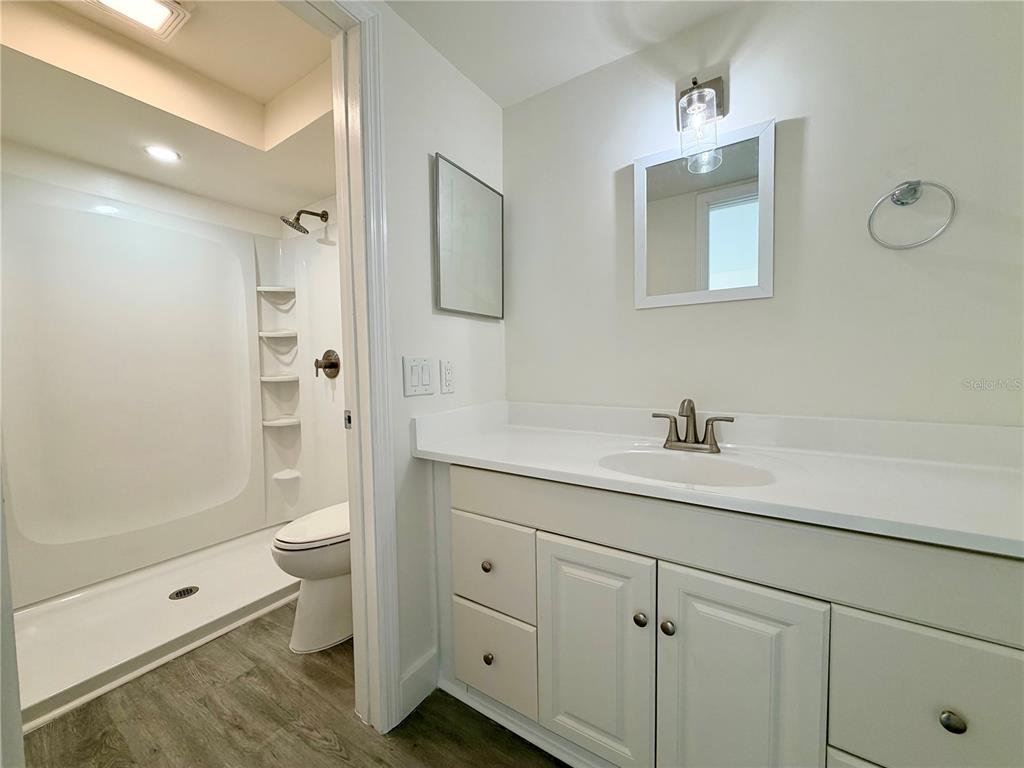 7314 Patio Row Hudson, FL 34667 - Photo 13 of 17 a bathroom with a sink a toilet and shower