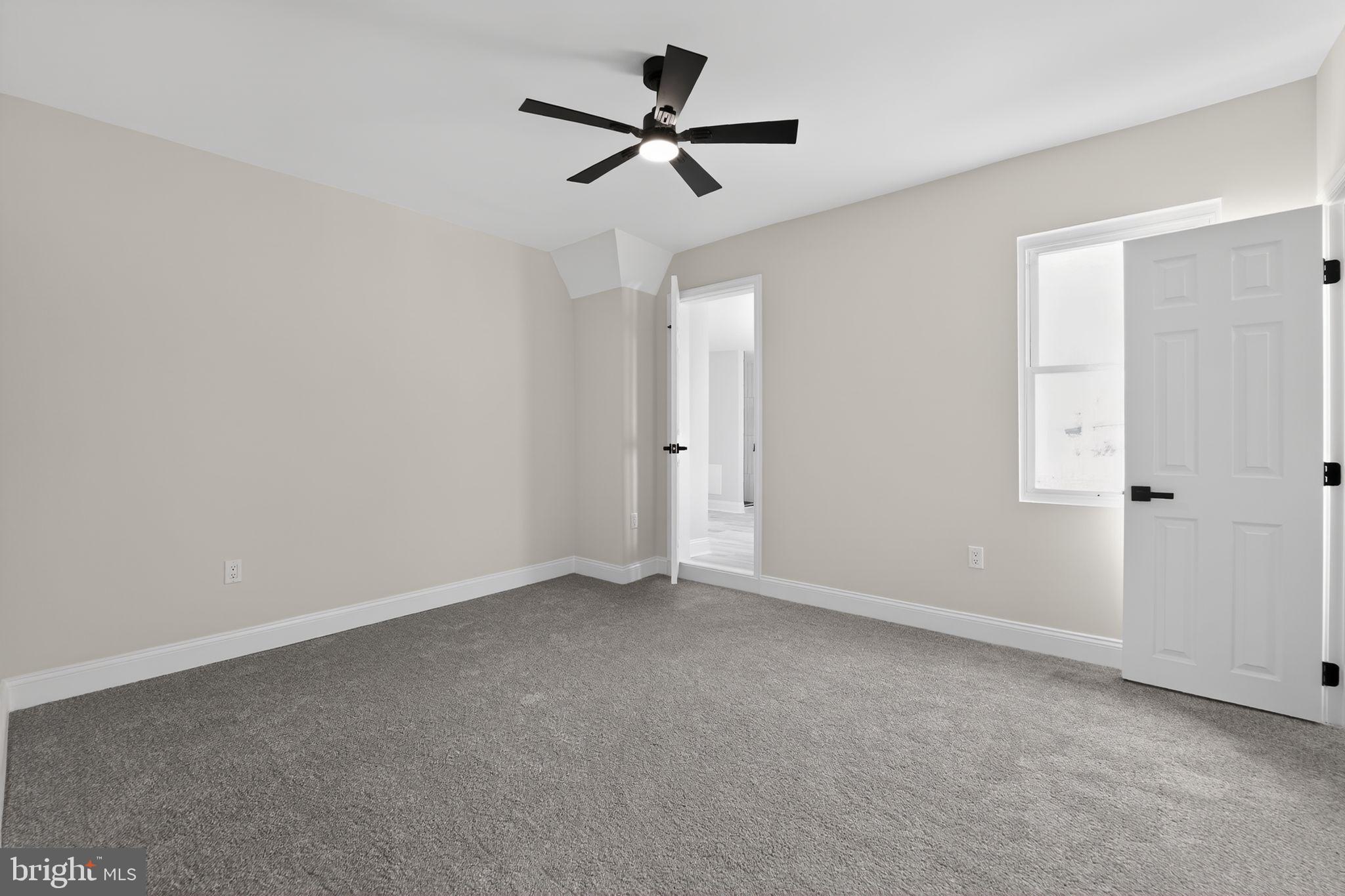 2911 Pinewood Avenue Baltimore, MD 21214 - Photo 15 of 30 an empty room with closet and a ceiling fan