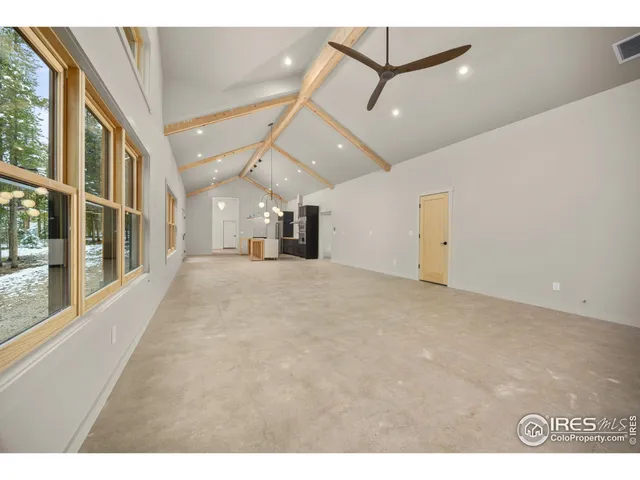 a view of a hall with a ceiling fan