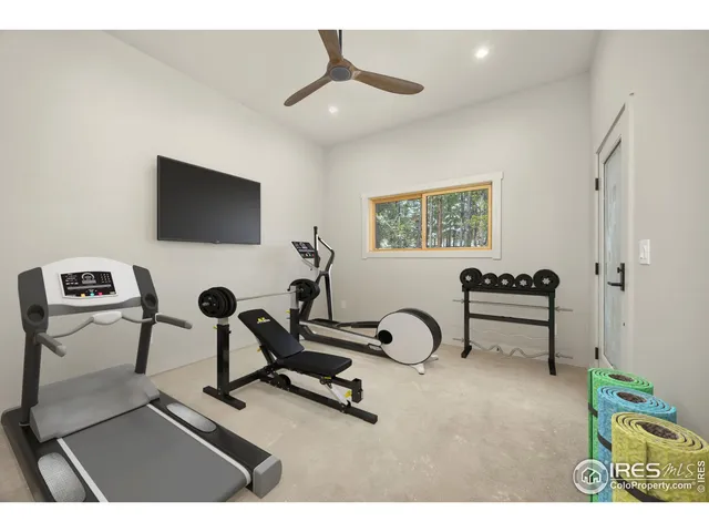 a view of a livingroom with furniture and a flat screen tv