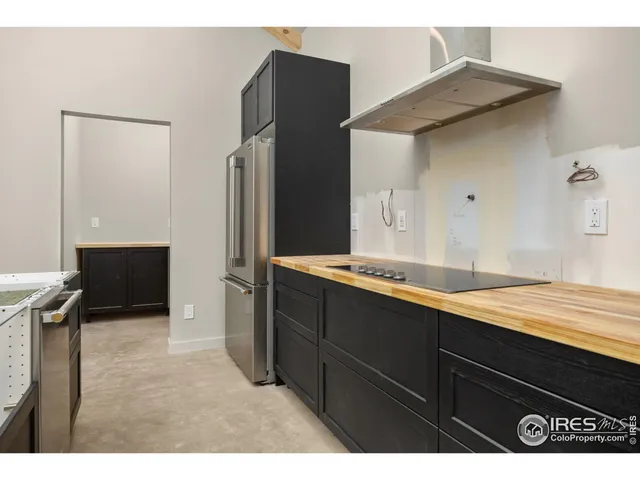 a kitchen with a sink and refrigerator
