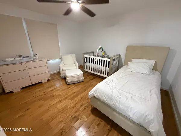 a bedroom with two beds and painted walls