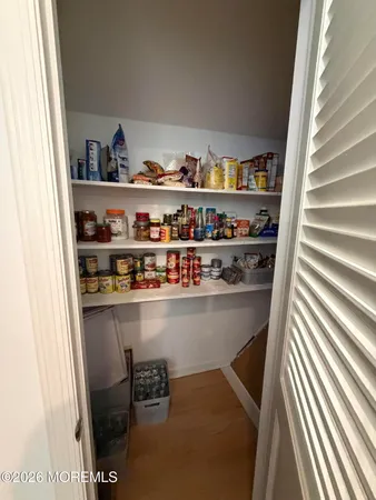 a shelf with cup and plates