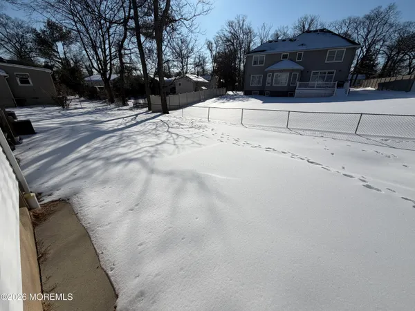 a view of a house with a snow on the road