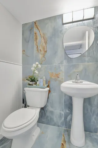 a bedroom with a bed and a television