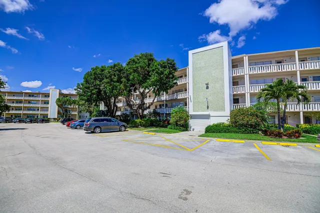 a view of a house with a yard and garage