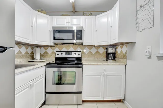 a view of a room with shelves and wooden floor