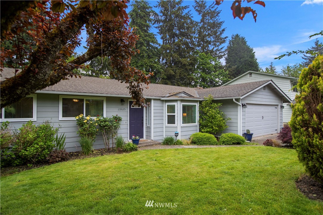 23625 48th Avenue Southeast Bothell, WA 98021 - Photo 2 of 40 a front view of a house with garden