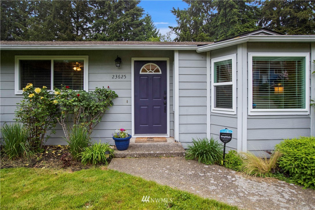 23625 48th Avenue Southeast Bothell, WA 98021 - Photo 3 of 40 a front view of a house with garden