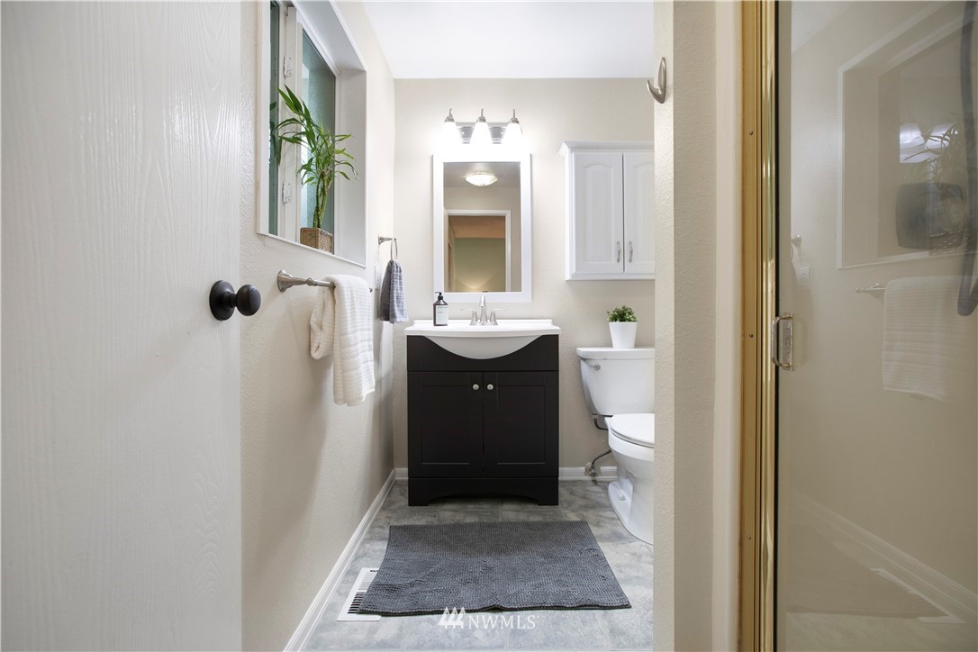 23625 48th Avenue Southeast Bothell, WA 98021 - Photo 22 of 40 a bathroom with a sink a toilet and shower