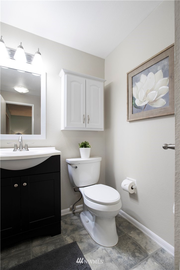 23625 48th Avenue Southeast Bothell, WA 98021 - Photo 23 of 40 a bathroom with a toilet sink and mirror