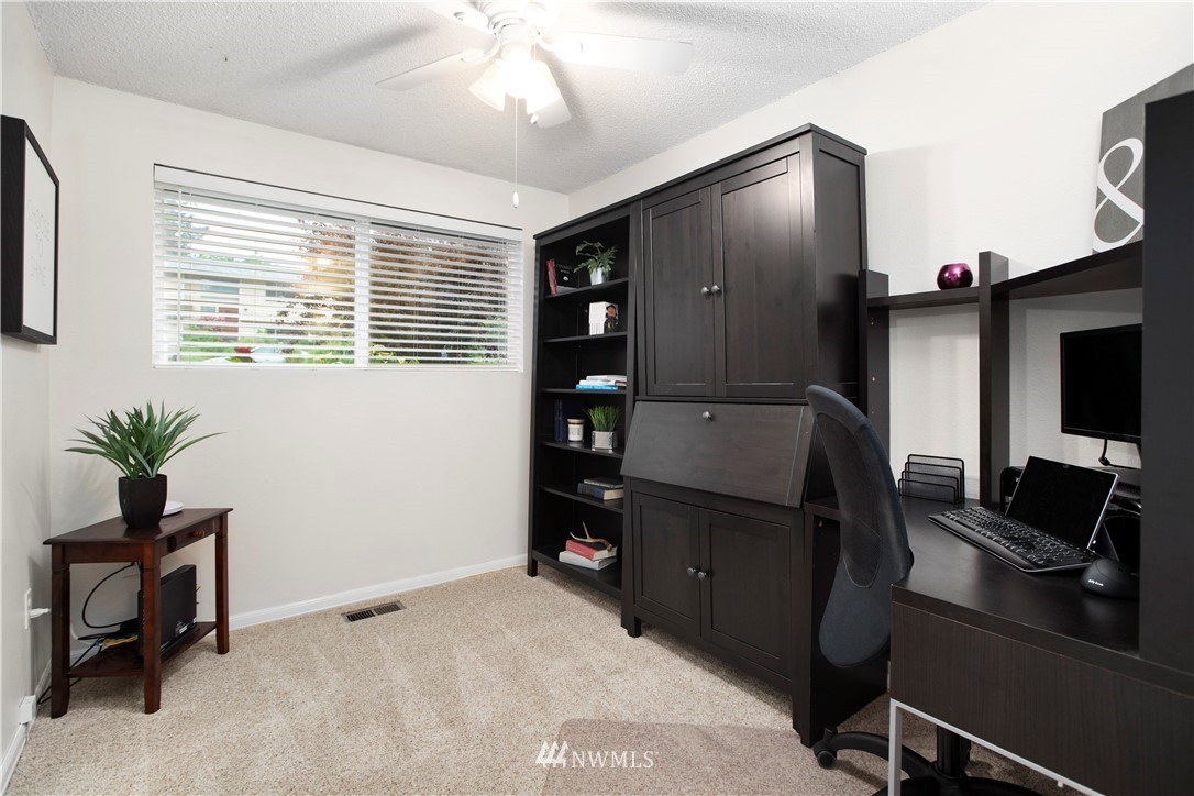 23625 48th Avenue Southeast Bothell, WA 98021 - Photo 24 of 40 a living room with furniture and a flat screen tv