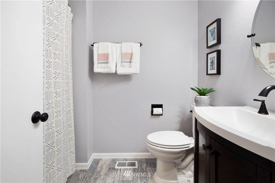 23625 48th Avenue Southeast Bothell, WA 98021 - Photo 26 of 40 a white toilet sitting next to a bathroom sink