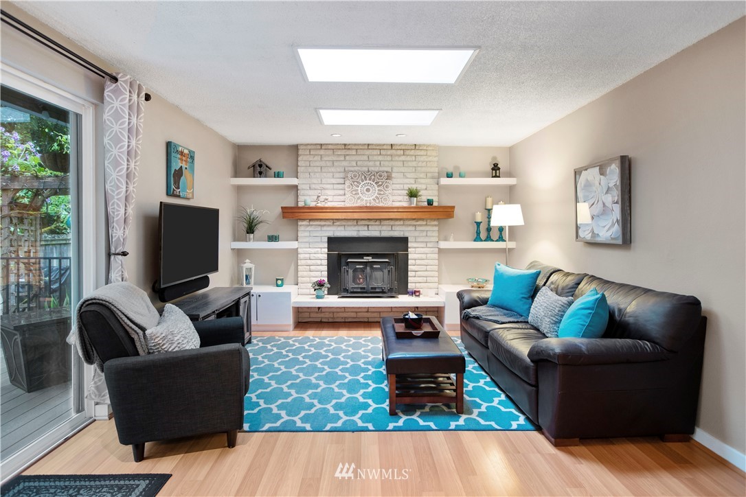 23625 48th Avenue Southeast Bothell, WA 98021 - Photo 27 of 40 a living room with furniture and a fireplace