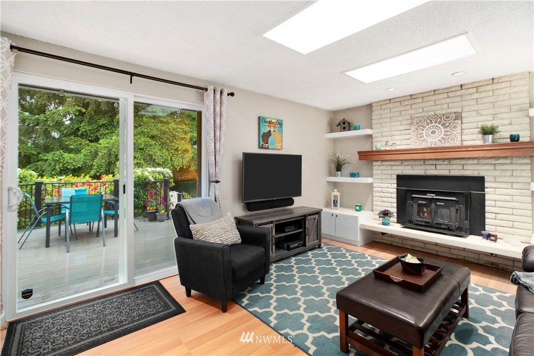 23625 48th Avenue Southeast Bothell, WA 98021 - Photo 29 of 40 a living room with furniture and a fireplace