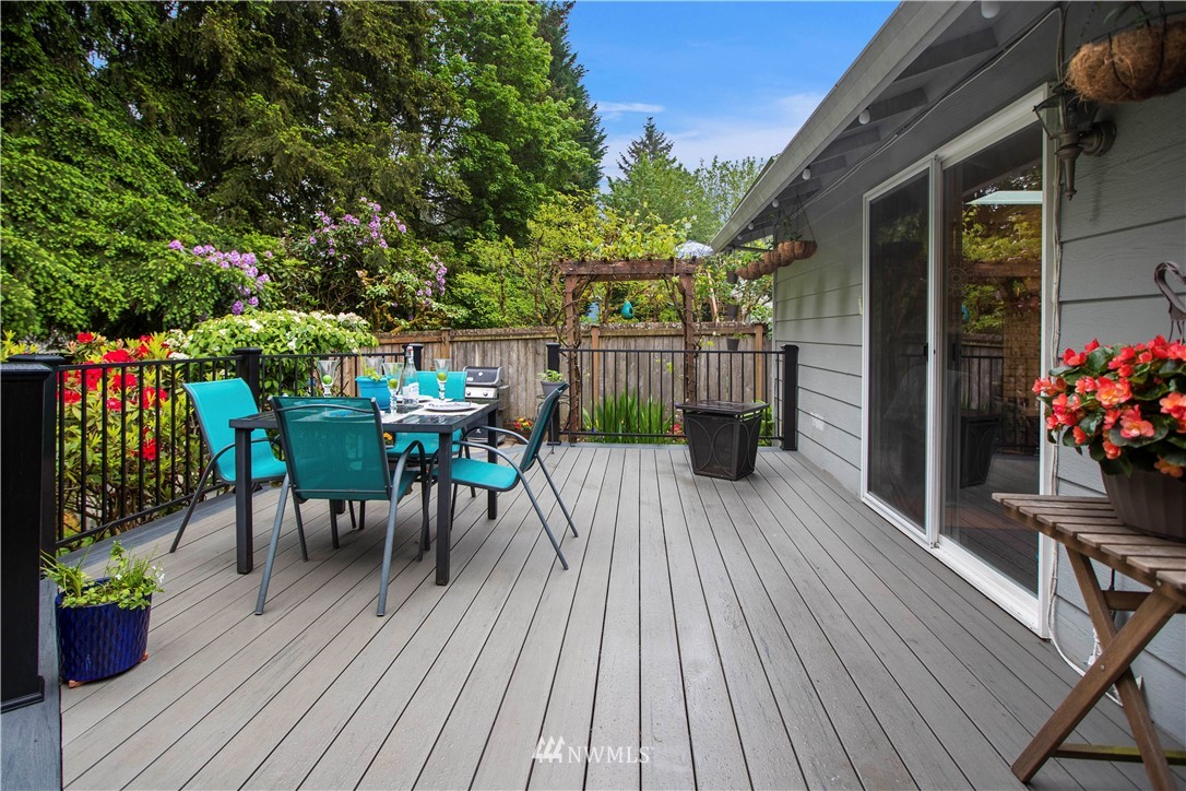 23625 48th Avenue Southeast Bothell, WA 98021 - Photo 30 of 40 a view of a chairs and table in patio with wooden floor