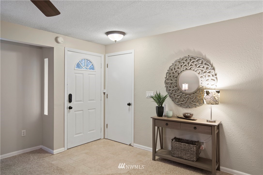 23625 48th Avenue Southeast Bothell, WA 98021 - Photo 4 of 40 an entryway view with a fireplace in it