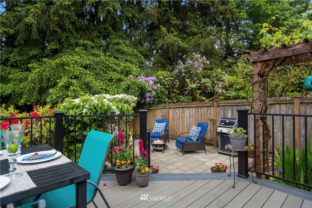 23625 48th Avenue Southeast Bothell, WA 98021 - Photo 32 of 40 a view of a chairs and tables in the back yard of the house