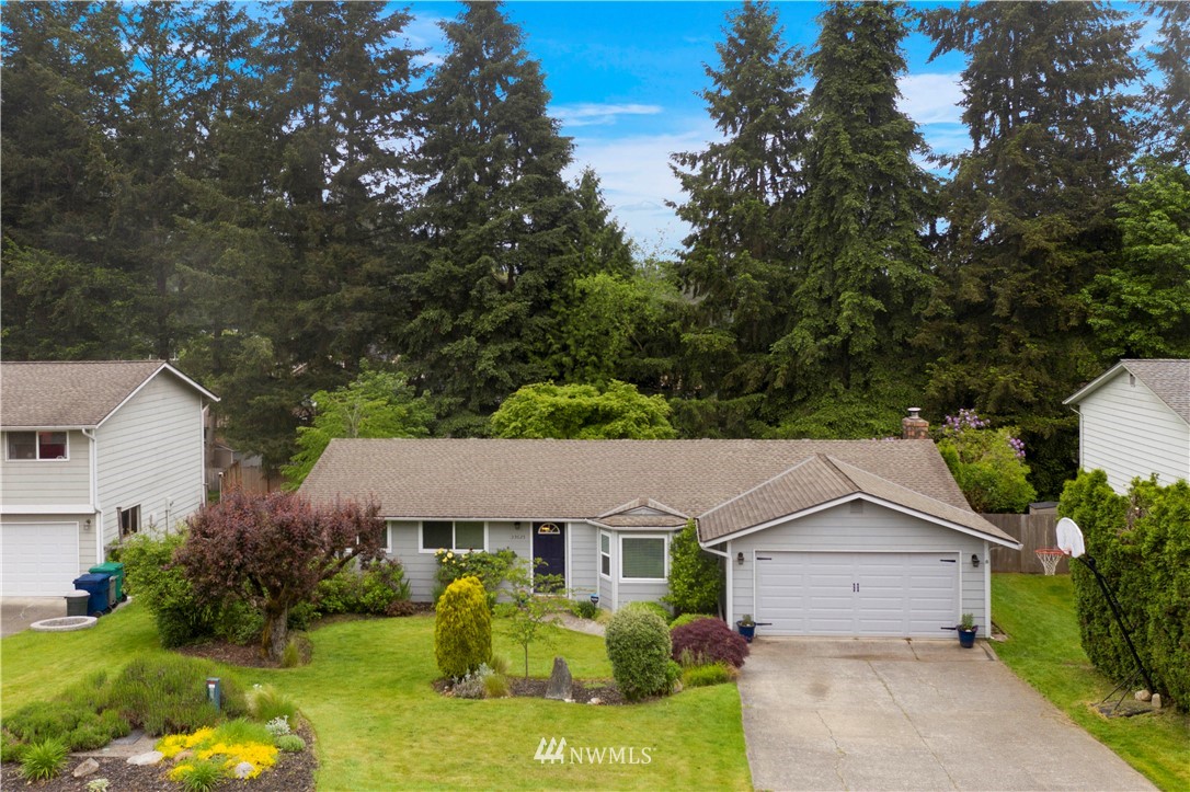 23625 48th Avenue Southeast Bothell, WA 98021 - Photo 37 of 40 a view of house with garden and tall tree