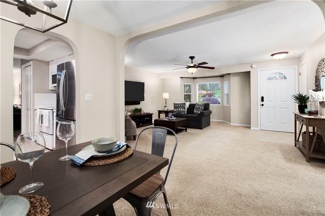 23625 48th Avenue Southeast Bothell, WA 98021 - Photo 10 of 40 a living room with furniture kitchen view and a window
