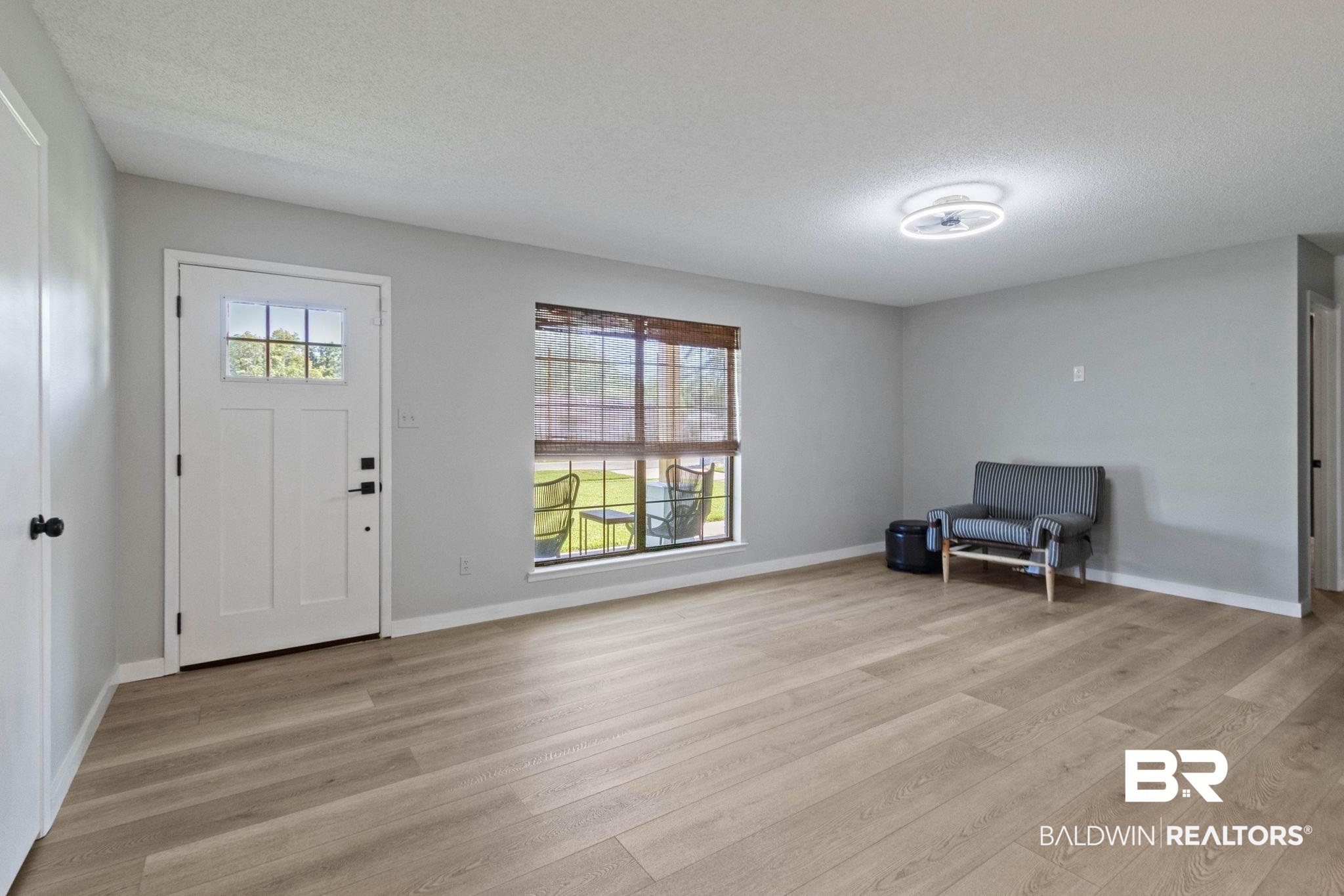 524 Ariel Avenue Foley, AL 36535 - Photo 5 of 37 Light wood-finish flooring complements neutral wall tones in this inviting living space