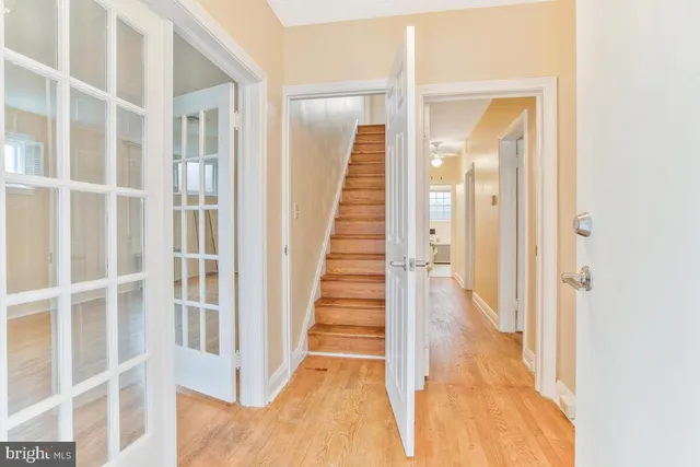 a view of staircase with white walls and windows