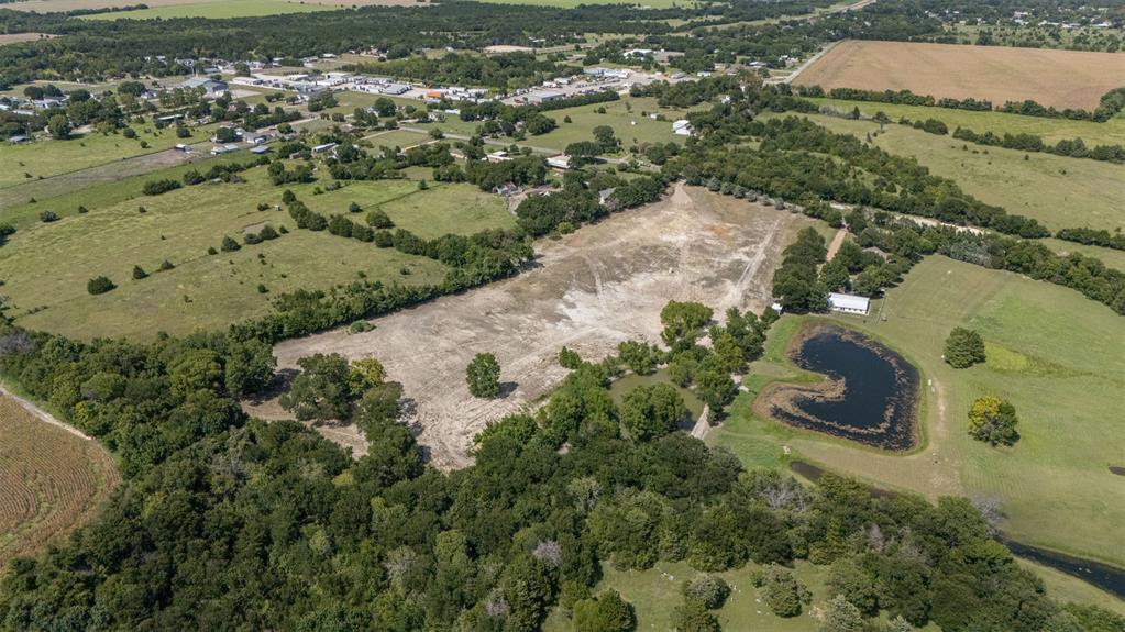 1065 Bluff Springs Road Ferris, TX 75125 - Photo 1 of 11 an aerial view of a house with a yard