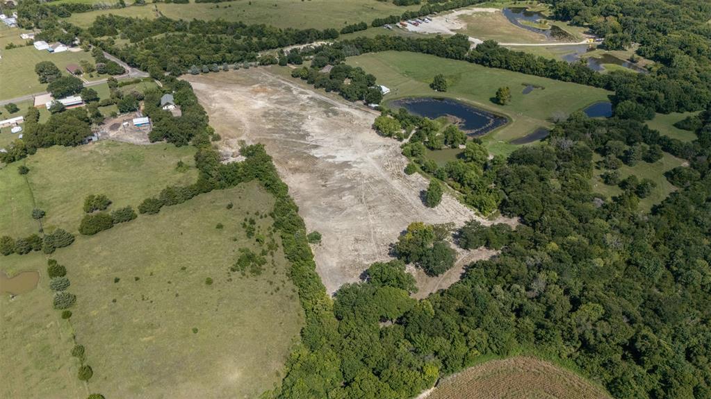 1065 Bluff Springs Road Ferris, TX 75125 - Photo 3 of 11 an aerial view of a residential houses with outdoor space
