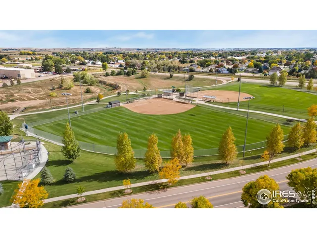 a view of a swimming pool with a lawn chairs