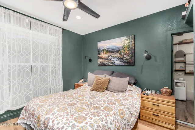 a view of dining room with wooden floor and white cabinet