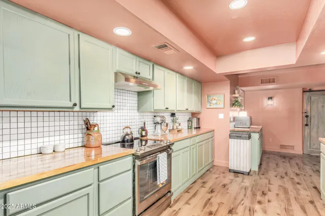 a kitchen with a sink cabinets and window